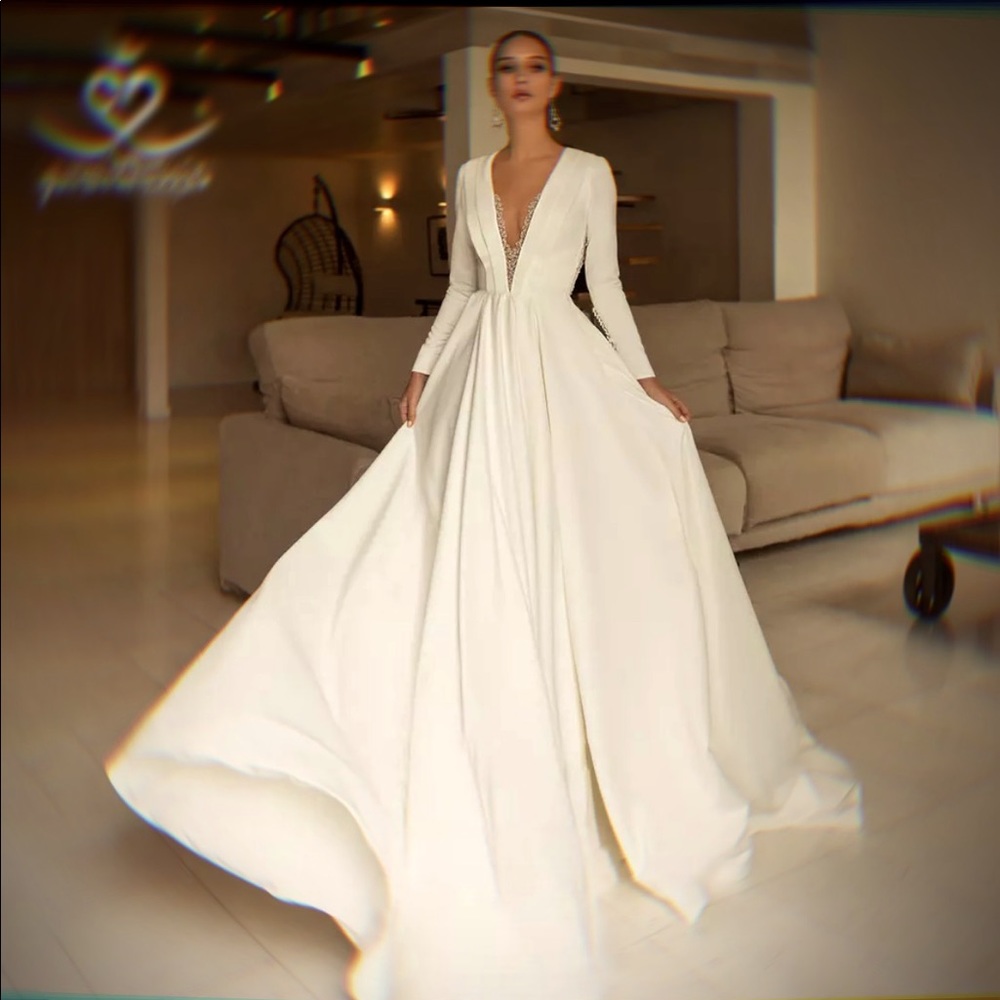 Ivory long sleeve beaded wedding dress